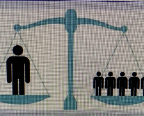 Photo of a balance scale with an individual on one side and several people on the other.